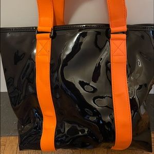 Marc By Marc Jacobs black patent leather shopper.  Neon Orange shoulder straps.
